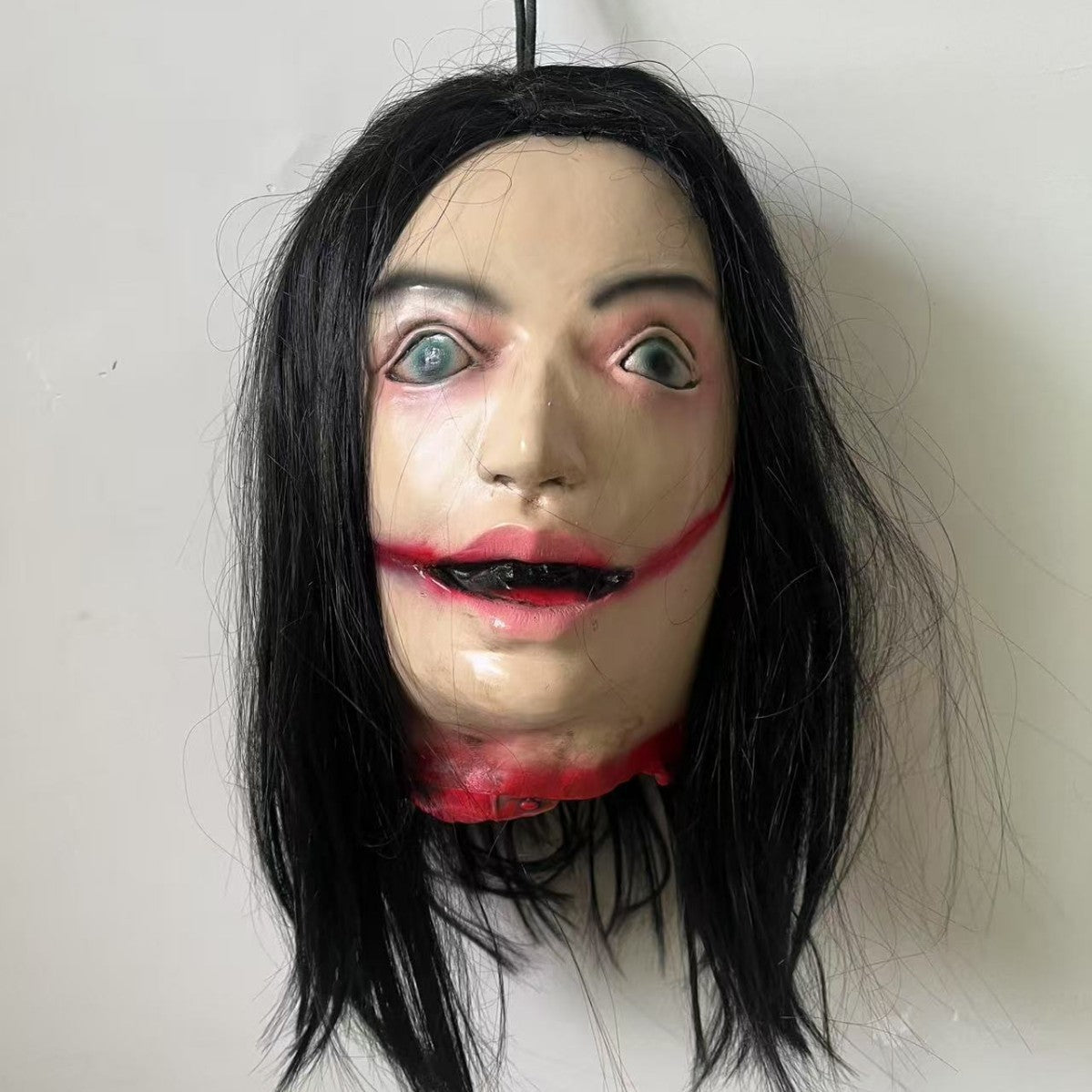 Lifelike Severed Head Horror Prop - 13-inch Hanging Decapitated Zombie Head with Realistic Bloody Details - Spooky Haunted House and Secret Room Decoration