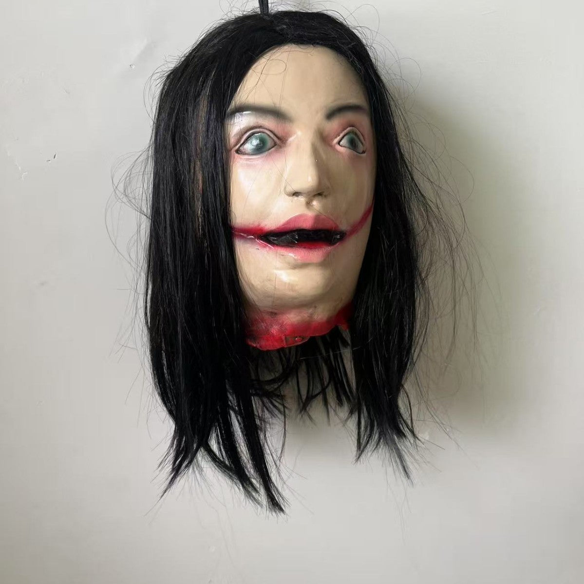 Lifelike Severed Head Horror Prop - 13-inch Hanging Decapitated Zombie Head with Realistic Bloody Details - Spooky Haunted House and Secret Room Decoration